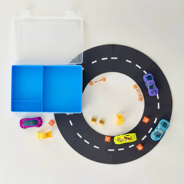 Toy car track set with toy cars on a white background
