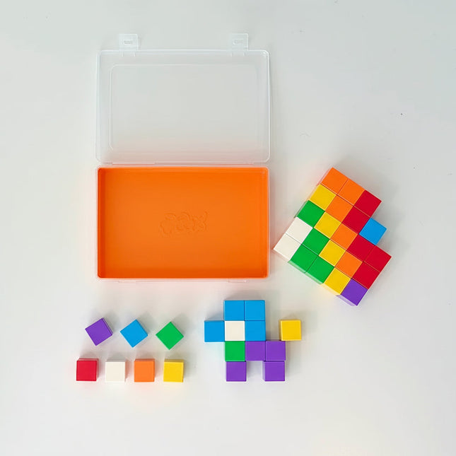 Colorful building blocks with a clear plastic case on a white background