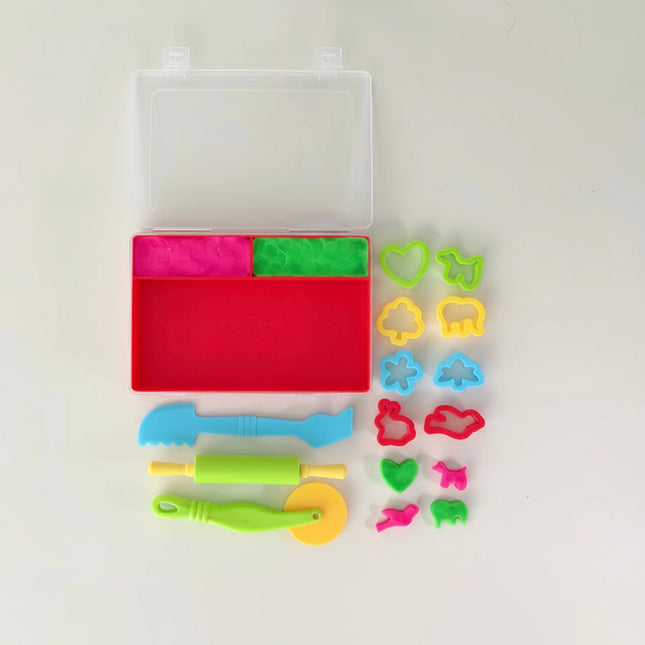 Colorful dough modeling set with tools and cutters on a white background